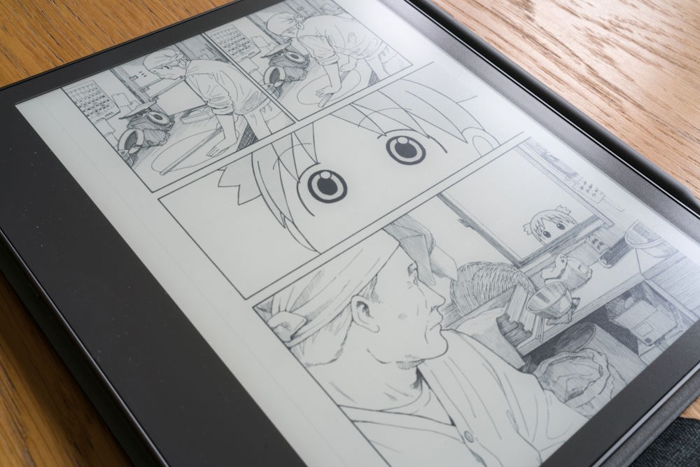 Close-up of manga panels on an e-ink screen showing crisp line art without banding.